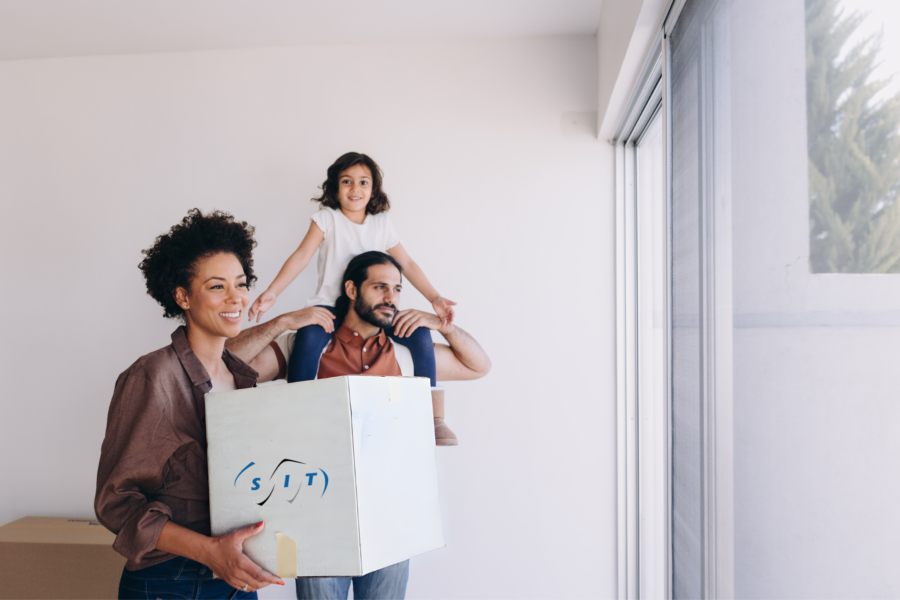 A couple wrapping possessions following the ways to pack your belongings for an international move